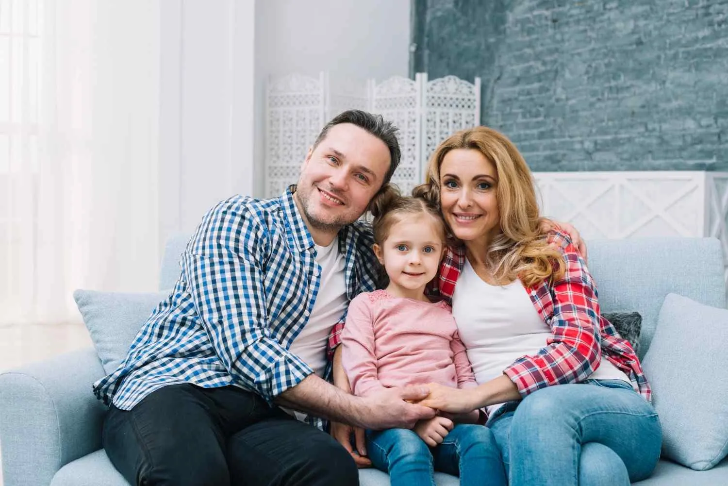 Family relaxed at home, protected by the right plan